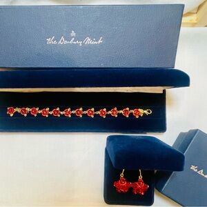14kt gold-clad bracelet and matching earrings “blooming” with a dozen red roses.